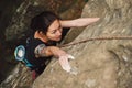 Beautiful young woman climbing on rock Royalty Free Stock Photo