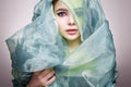 Beautiful young woman in color silk veil. colorful make-up girl Royalty Free Stock Photo