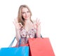 Beautiful young woman with colored gift bags doing ok gesture Royalty Free Stock Photo