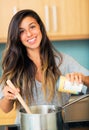 Beautiful Young Woman Cooking Dinner