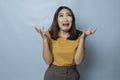 Beautiful young woman crying feeling very depressed  by blue background shouting loud Royalty Free Stock Photo