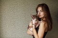 Beautiful young woman with cute cat resting at home Royalty Free Stock Photo