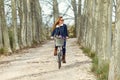 Beautiful young woman cycling in the park. Royalty Free Stock Photo