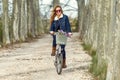 Beautiful young woman cycling in the park. Royalty Free Stock Photo