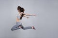 Beautiful young woman dancer jumping in studio Royalty Free Stock Photo