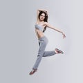 Beautiful young woman dancer jumping in studio Royalty Free Stock Photo