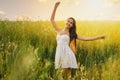 Beautiful young woman dancing in the field Royalty Free Stock Photo
