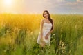 Beautiful young woman dancing in the field Royalty Free Stock Photo