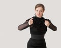 Beautiful young woman dancing flamenco in a black dress and looking at the camera Royalty Free Stock Photo