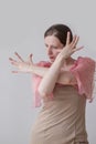 Beautiful young woman dancing flamenco in a pink beige dress Royalty Free Stock Photo