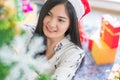 Beautiful young woman decorating xmas ornament on Christmas tree for Christmas and New Year holiday Royalty Free Stock Photo