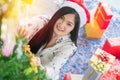 Beautiful young woman decorating xmas ornament on Christmas tree for Christmas and New Year holiday Royalty Free Stock Photo