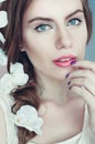 Beautiful young woman with delicate flowers in their hair Royalty Free Stock Photo