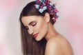 Beautiful young woman with delicate flowers in their hair. Beauty Girl with Flowers Hairstyle.Model portrait with Summer Royalty Free Stock Photo