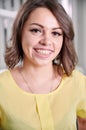 Beautiful young woman demonstrating teeth with braces.