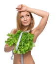 Beautiful Young Woman on diet with healthy food salad and tape m Royalty Free Stock Photo