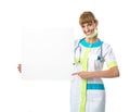 Beautiful young woman doctor showing blank board Royalty Free Stock Photo