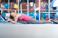 Beautiful young woman doing gimnastics on the floor Royalty Free Stock Photo