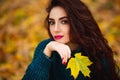 Beautiful young woman. Dramatic outdoor autumn portrait of sensual brunette female with long hair. Sad and serious girl. Royalty Free Stock Photo