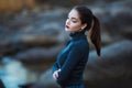 Beautiful young woman. Dramatic outdoor portrait of sensual brunette female with long hair. Sad girl in depression.