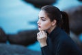 Beautiful young woman. Dramatic outdoor portrait of sensual brunette female with long hair. Sad girl in depression.