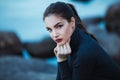 Beautiful young woman. Dramatic outdoor portrait of sensual brunette female with long hair. Sad and serious girl. Royalty Free Stock Photo