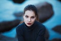 Beautiful young woman. Dramatic outdoor portrait of sensual brunette female with long hair. Sad and serious girl. Royalty Free Stock Photo