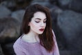 Beautiful young woman. Dramatic outdoor portrait of sensual brunette female with long hair. Sad and serious girl. Royalty Free Stock Photo