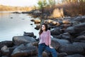 Beautiful young woman. Dramatic outdoor portrait of sensual brunette female with long hair. Sad and serious girl.