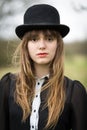 Beautiful Young Woman Dressed In Black Wearing Bowler Hat Royalty Free Stock Photo