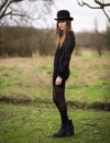 Beautiful Young Woman Dressed In Black Wearing Bowler Hat Royalty Free Stock Photo