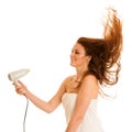 Beautiful young woman dries hair with a blow dryer Royalty Free Stock Photo