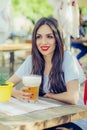 Beautiful young woman drinking beer and enjoying summer day Royalty Free Stock Photo