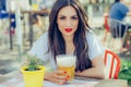 Beautiful young woman drinking beer and enjoying summer day Royalty Free Stock Photo