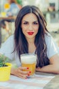 Beautiful young woman drinking beer and enjoying summer day Royalty Free Stock Photo