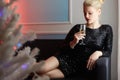 Beautiful young woman drinking champagne at home Royalty Free Stock Photo