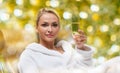 Beautiful young woman drinking champagne at spa Royalty Free Stock Photo