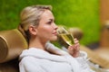 Beautiful young woman drinking champagne at spa Royalty Free Stock Photo