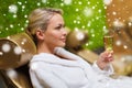 Beautiful young woman drinking champagne at spa Royalty Free Stock Photo