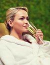 Beautiful young woman drinking champagne at spa Royalty Free Stock Photo