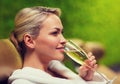 Beautiful young woman drinking champagne at spa Royalty Free Stock Photo