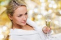 Beautiful young woman drinking champagne at spa Royalty Free Stock Photo