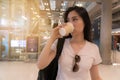 Beautiful young woman drinking coffee.For the hustle and bustle of traveling. Royalty Free Stock Photo