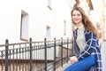 Beautiful young woman drinking coffee outside Royalty Free Stock Photo