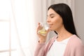 Beautiful young woman drinking fresh lemon water Royalty Free Stock Photo