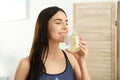 Beautiful young woman drinking fresh lemon water Royalty Free Stock Photo