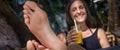 Beautiful young woman drinking fruit cocktail on a tropical beach Royalty Free Stock Photo