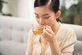 Beautiful Young Woman drinking hot tea Royalty Free Stock Photo