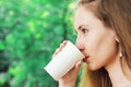 Beautiful young woman drinking takeaway coffee Royalty Free Stock Photo