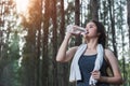 Beautiful young woman drinking water bottle after exercise fitness Royalty Free Stock Photo